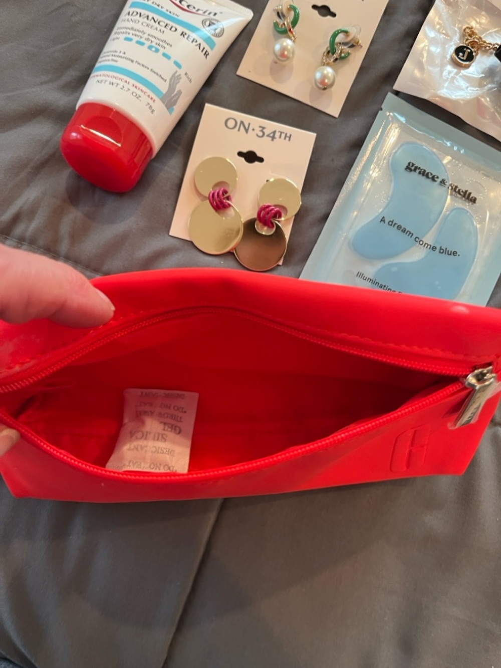 Clinique Red Cosmetic Pouch - Filled with beauty accessories. - Picture 4 of 9